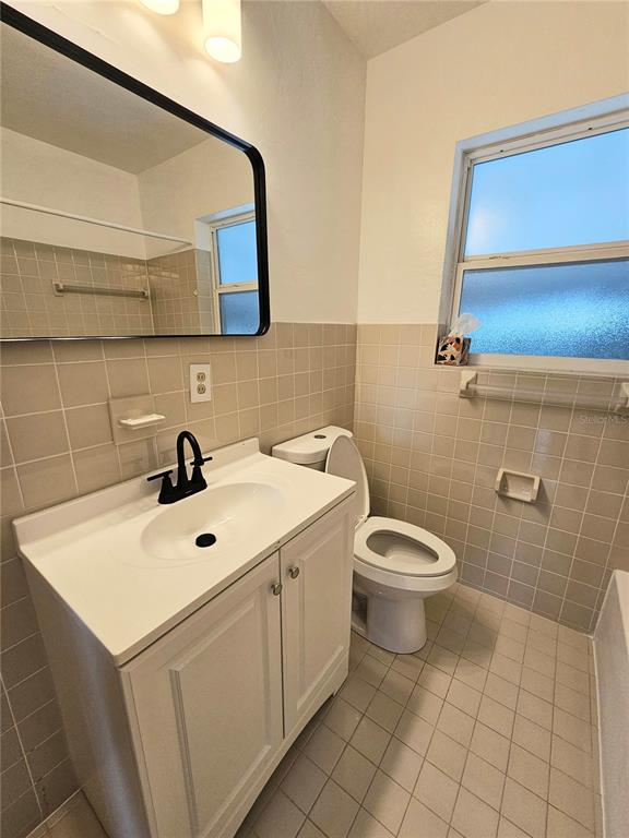 49 Azalea Drive DeBary, FL 32713 - Photo 12 of 25 a bathroom with a sink a toilet and mirror
