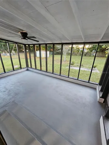 a view of an empty room with a balcony