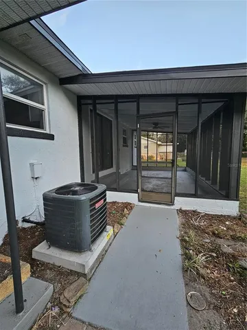a view of a hallway with seating area