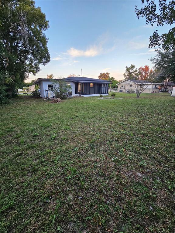 49 Azalea Drive DeBary, FL 32713 - Photo 22 of 25 a view of a house with a yard