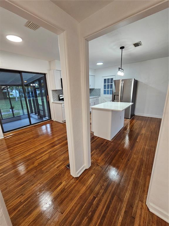 49 Azalea Drive DeBary, FL 32713 - Photo 10 of 25 a view of kitchen island wooden floor
