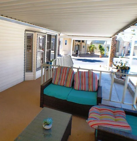 a view of balcony with furniture