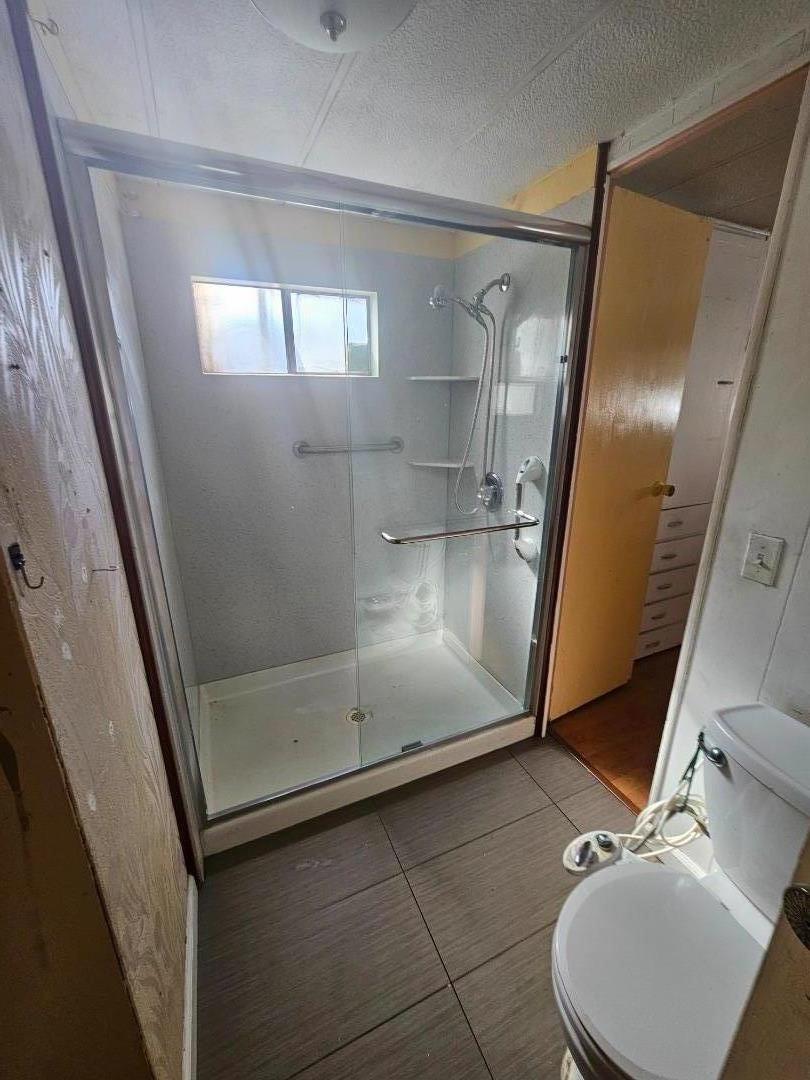 60 Wilson Way, Unit 104 Milpitas, CA 95035 - Photo 6 of 8 a view of a livingroom with wooden floor and windows