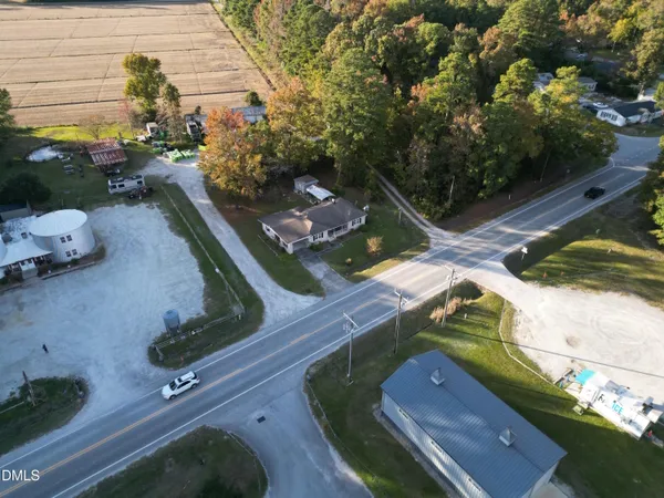 an aerial view of a house with a yard