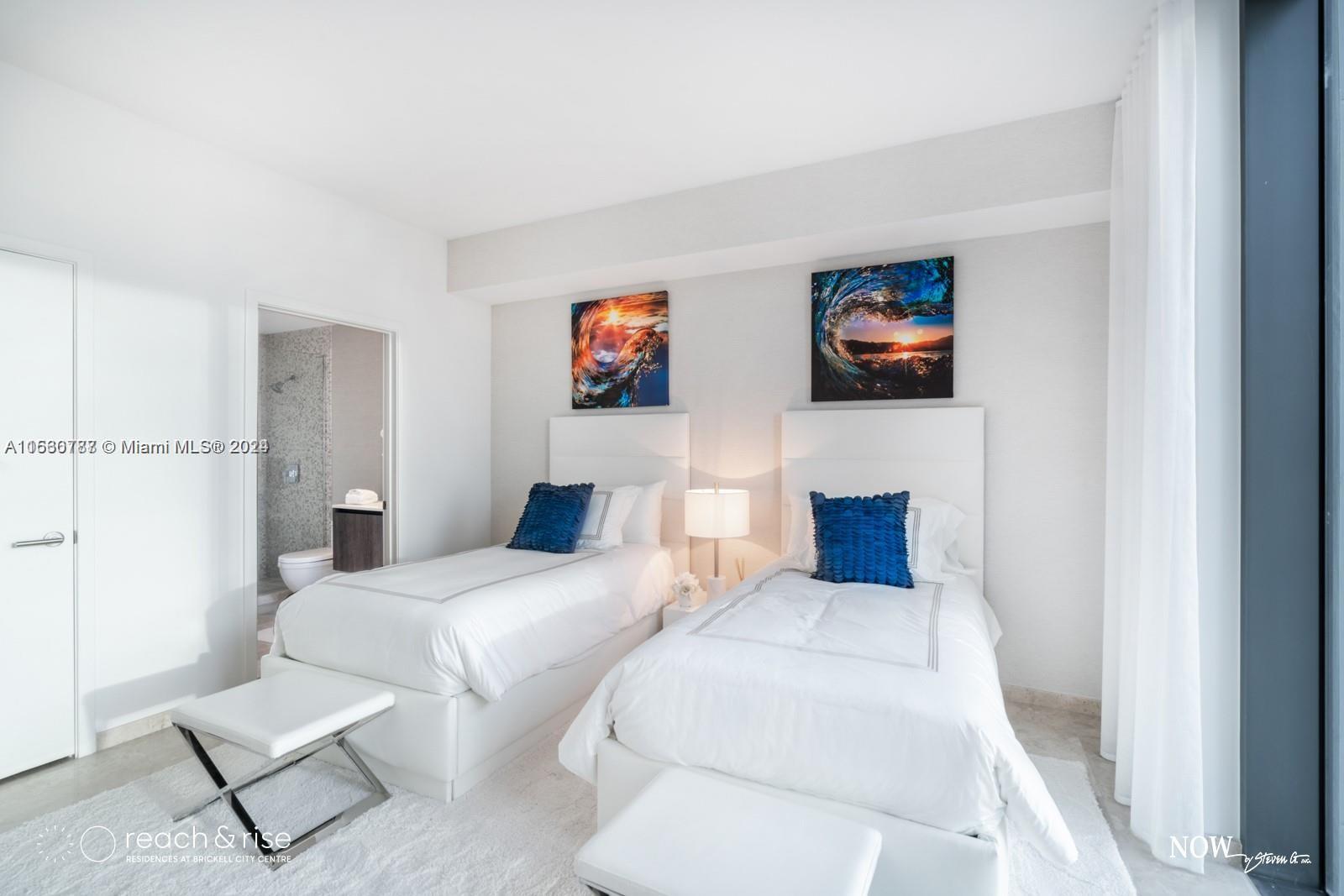 88 Southwest 7th Street, Unit 1403 Miami, FL 33130 - Photo 12 of 15 a bedroom with furniture and a flat screen tv