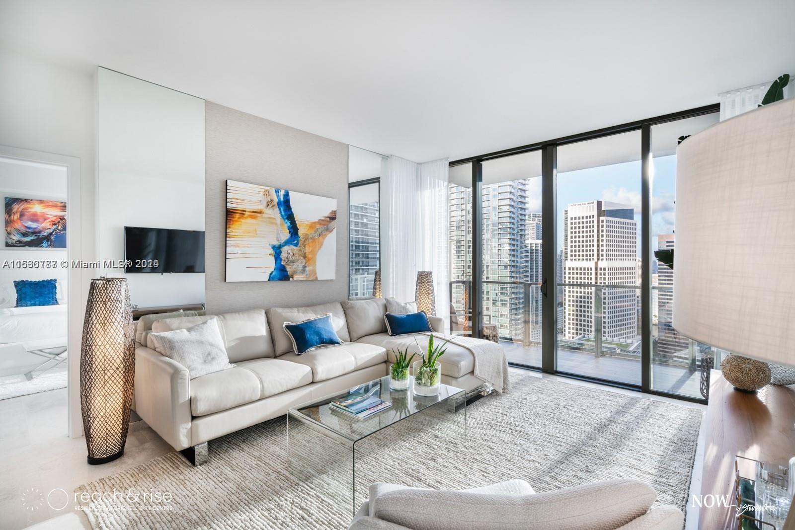 88 Southwest 7th Street, Unit 1403 Miami, FL 33130 - Photo 15 of 15 a living room with furniture and a large window
