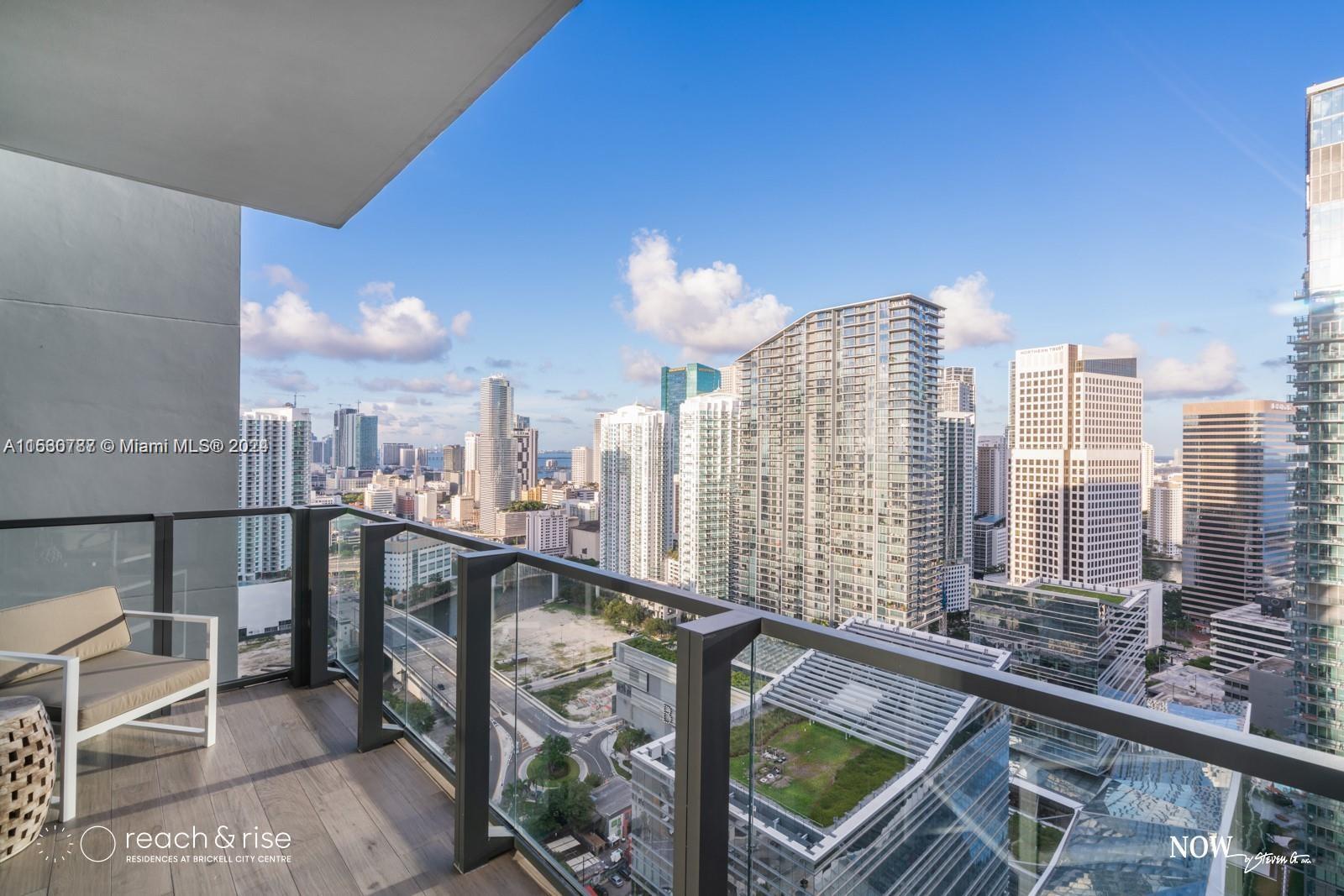 88 Southwest 7th Street, Unit 1403 Miami, FL 33130 - Photo 2 of 15 a view of a city from a balcony with city view