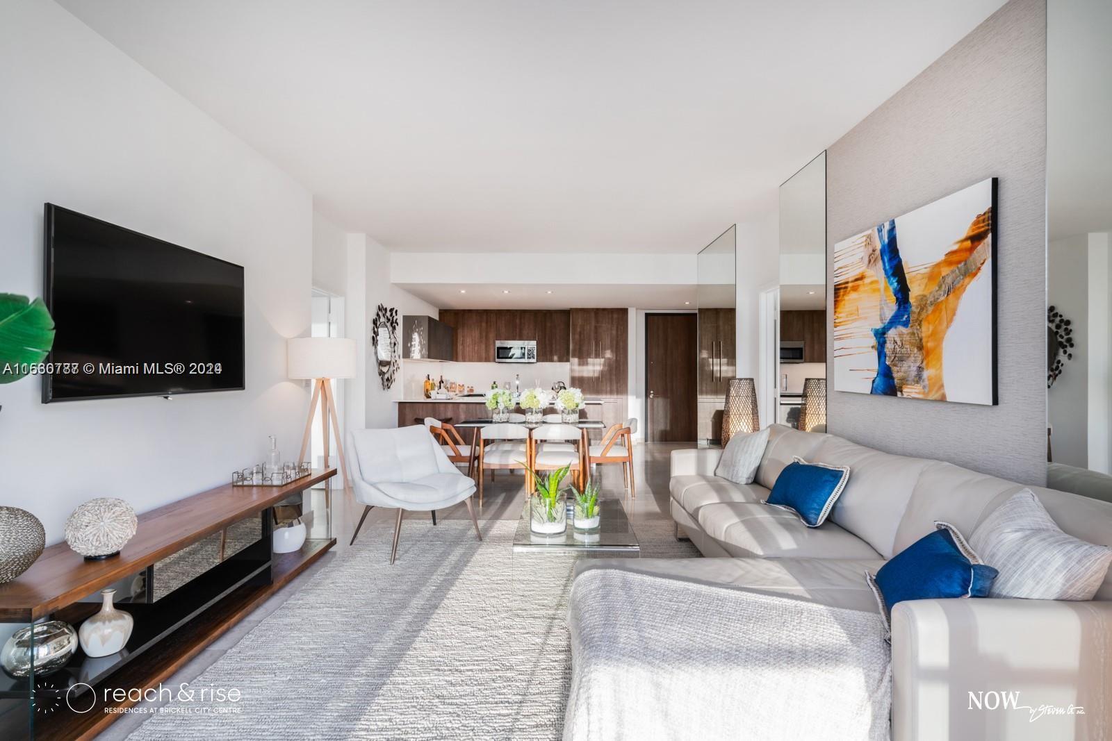 88 Southwest 7th Street, Unit 1403 Miami, FL 33130 - Photo 3 of 15 a living room with furniture and a flat screen tv