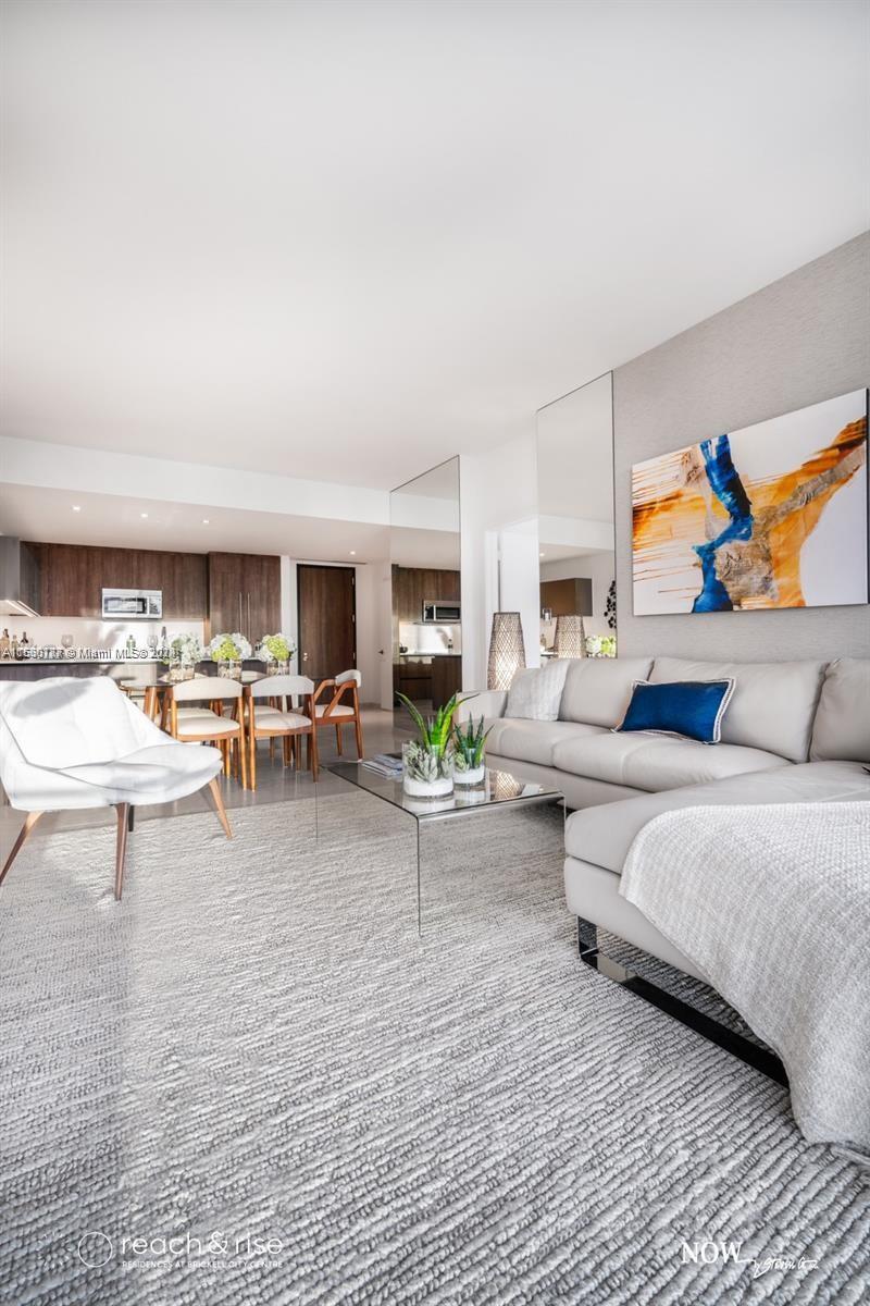 88 Southwest 7th Street, Unit 1403 Miami, FL 33130 - Photo 6 of 15 a living room with furniture and a couch