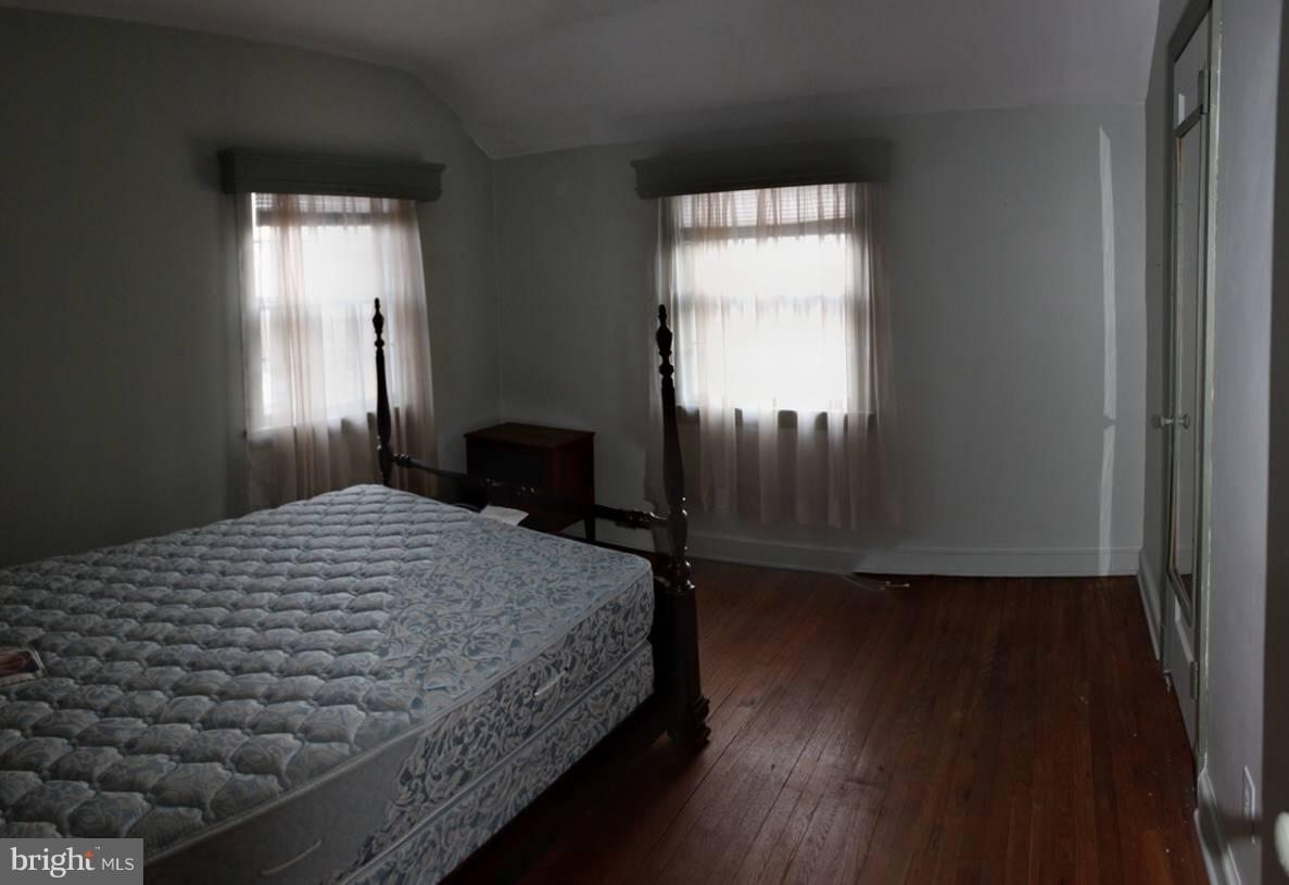 9009 Walden Road Silver Spring, MD 20901 - Photo 18 of 22 a bedroom with a bed and a window