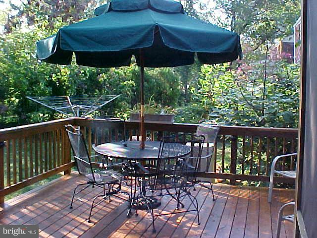 9009 Walden Road Silver Spring, MD 20901 - Photo 20 of 22 a view of a table and chairs in patio
