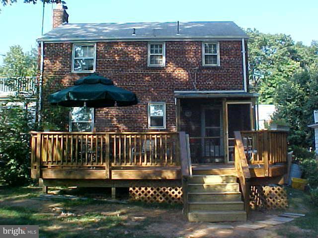 9009 Walden Road Silver Spring, MD 20901 - Photo 21 of 22 a view of a house with a yard and furniture