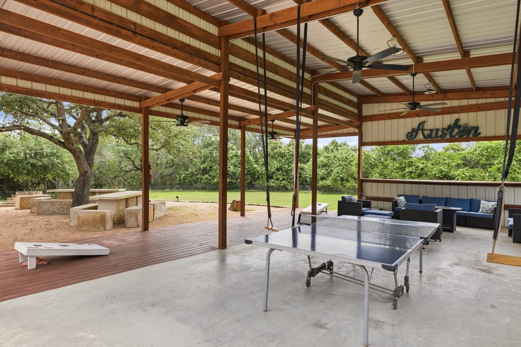 12135 Fitzhugh Road Austin, TX 78736 - Photo 22 of 30 a living room with furniture and a large window