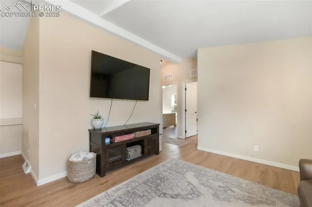a living room with furniture window and a lamp