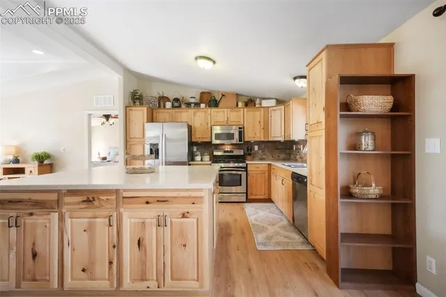 a kitchen with a sink stove top oven and cabinets