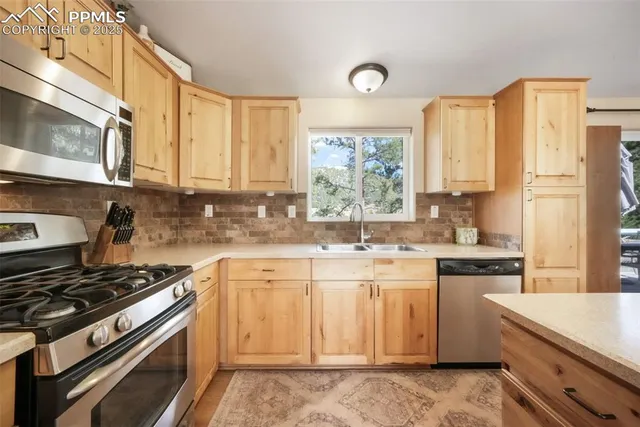 a kitchen with granite countertop a sink and cabinets