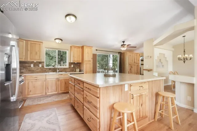 a large kitchen with a lot of counter space and appliances