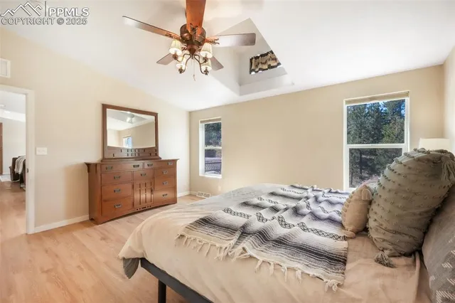 a bathroom with a granite countertop sink mirror and a bathtub