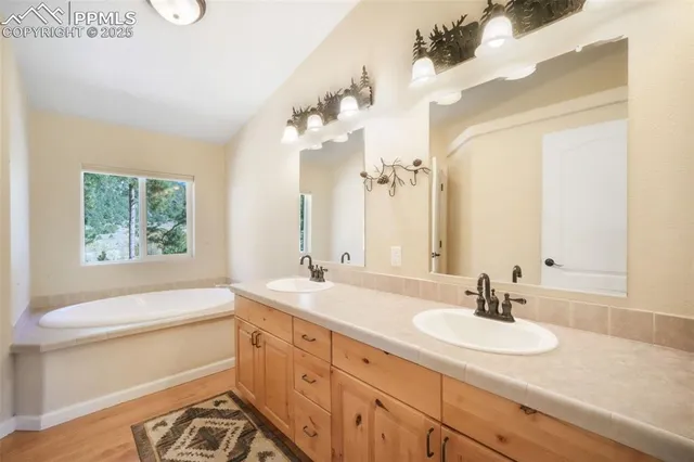 a bathroom with a toilet a sink and a window