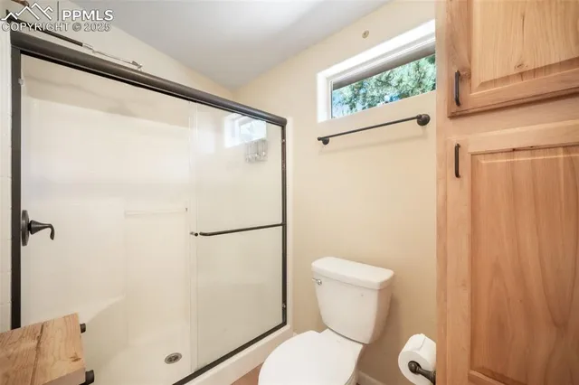 a bedroom with a bed and a table in it