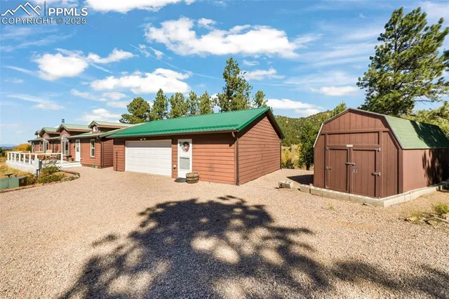 a view of a house with wooden fence