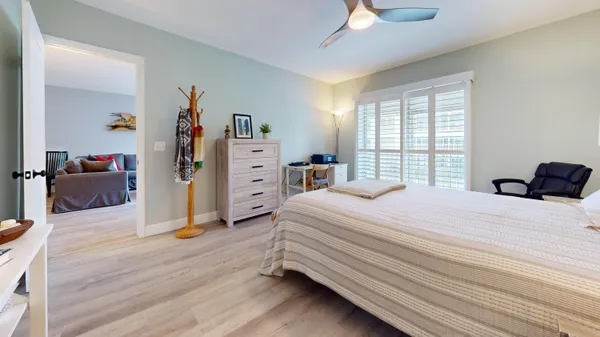 a bedroom with a bed and a closet