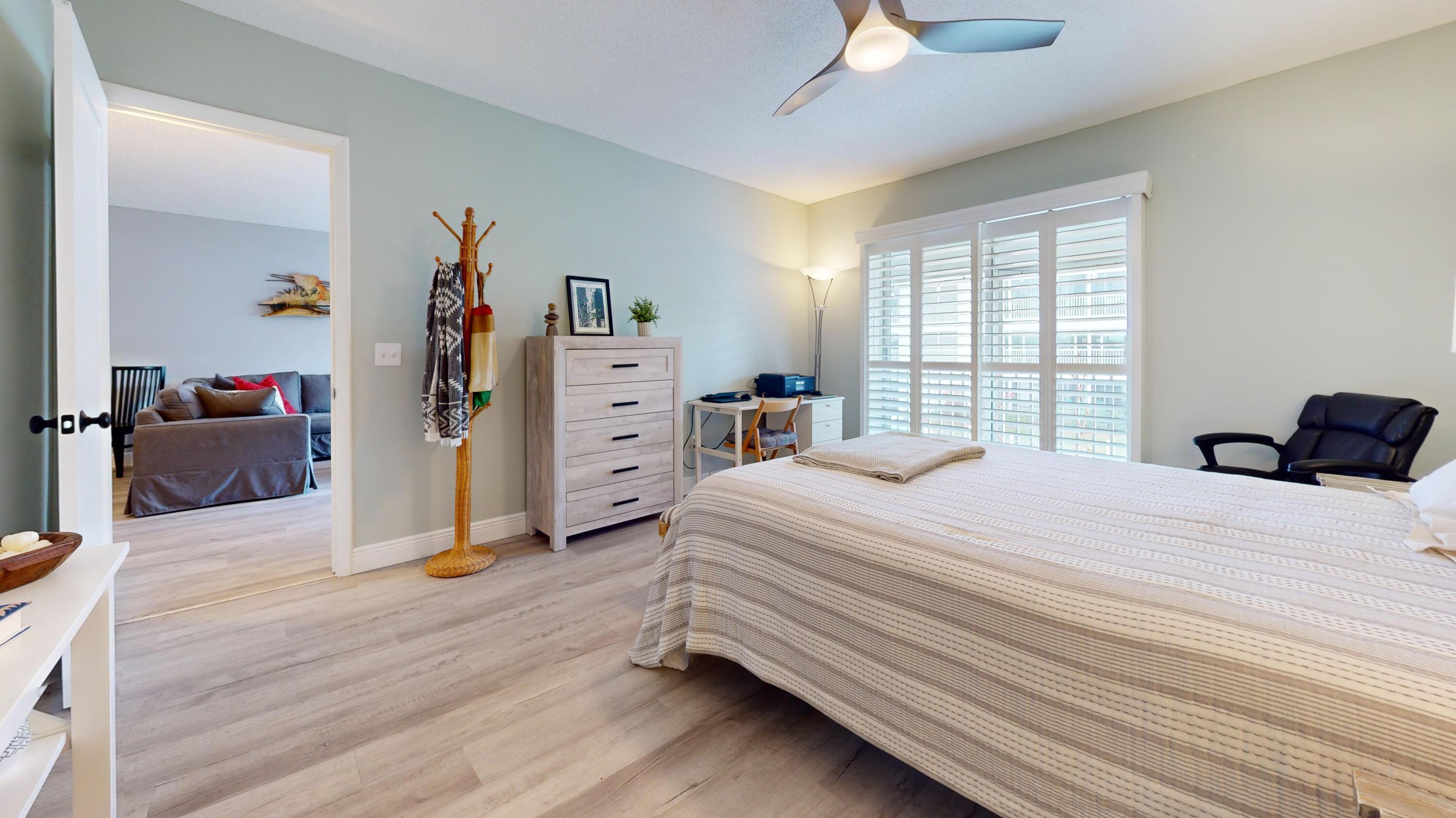 1856 Southwest Palm City Road, Unit 203 Stuart, FL 34994 - Photo 11 of 22 a bedroom with a bed and a closet