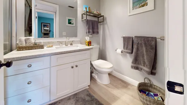 a bathroom with a sink a bathtub and shower