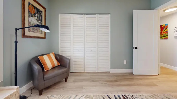 a view of livingroom with furniture and workspace