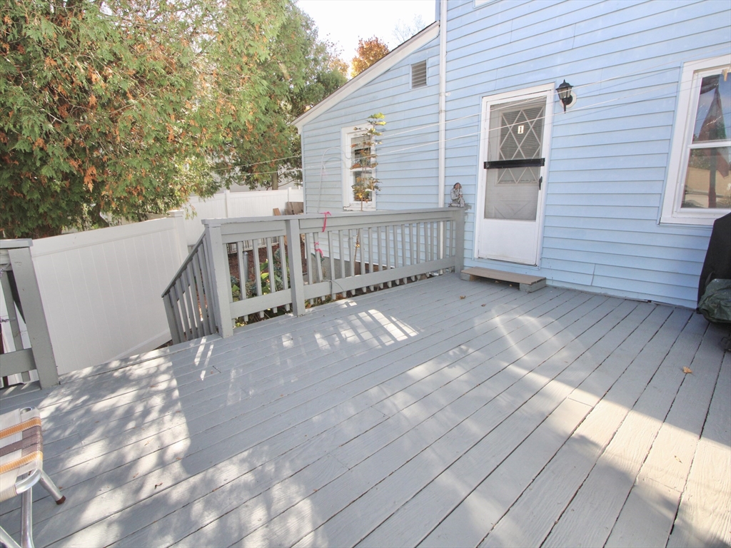 5 Benham Street Worcester, MA 01604 - Photo 5 of 18 a view of a deck with wooden floor and fence
