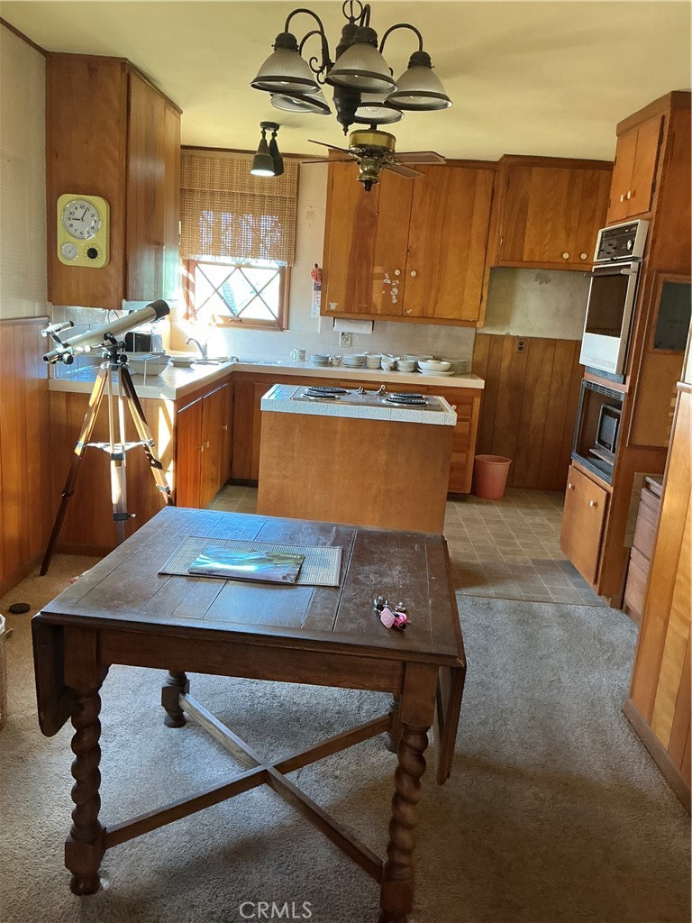 841 Virginia Street El Segundo, CA 90245 - Photo 3 of 7 a room with table chairs and appliances