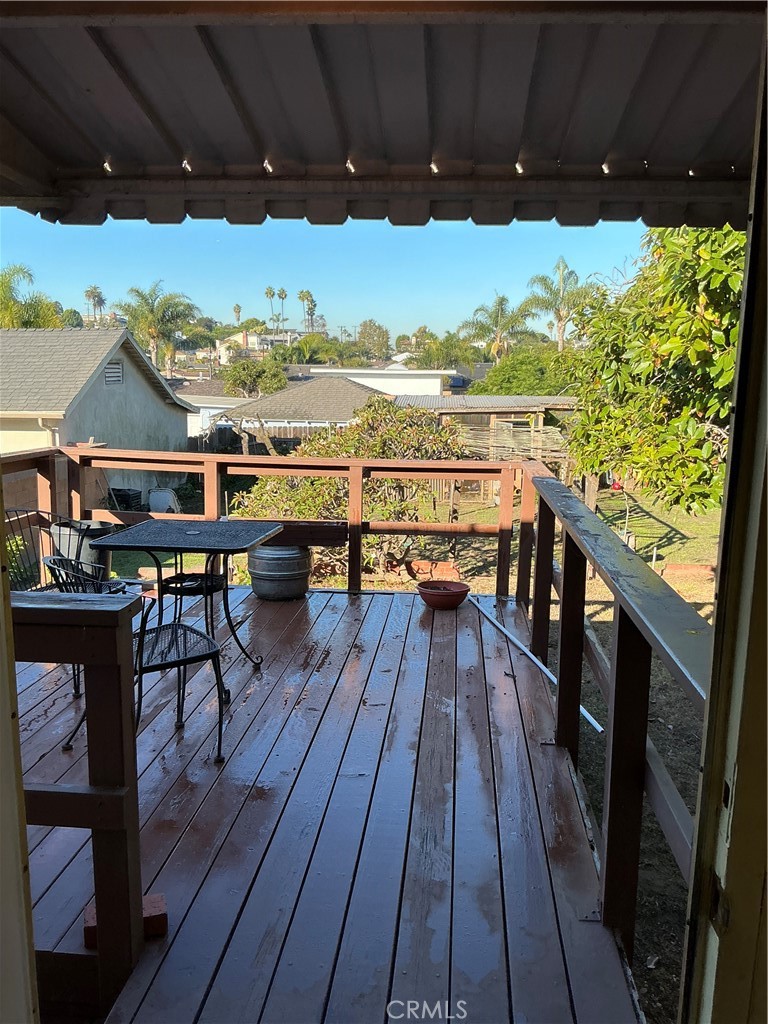 841 Virginia Street El Segundo, CA 90245 - Photo 5 of 7 a view of balcony with wooden floor and outdoor seating