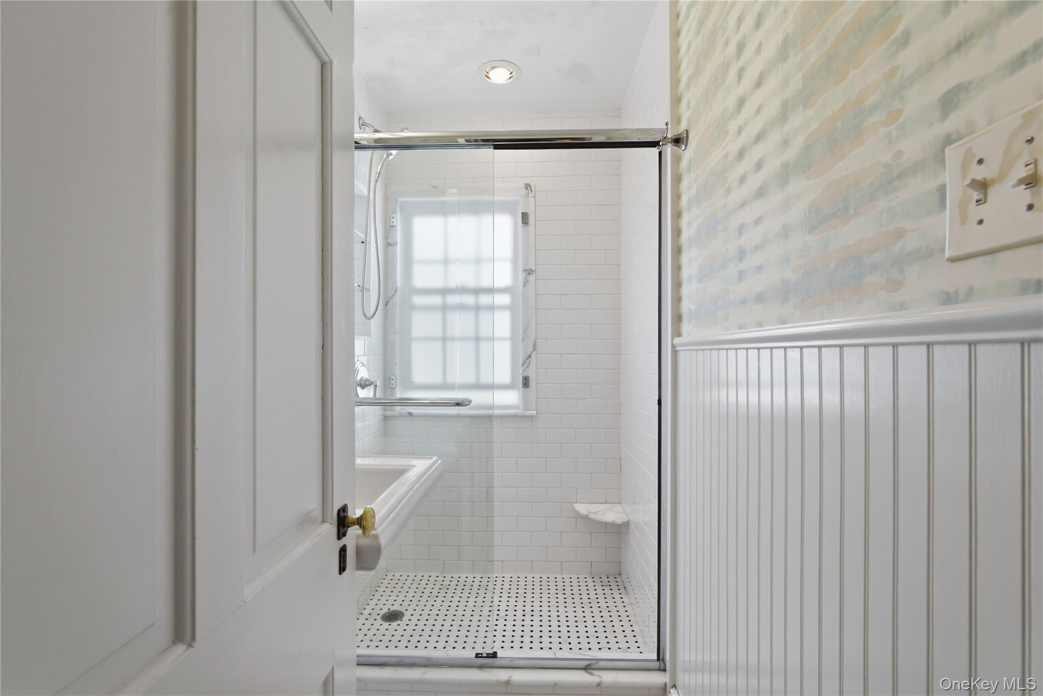 32 Kingsbury Road New Rochelle, NY 10804 - Photo 16 of 31 a bathroom with a glass shower door