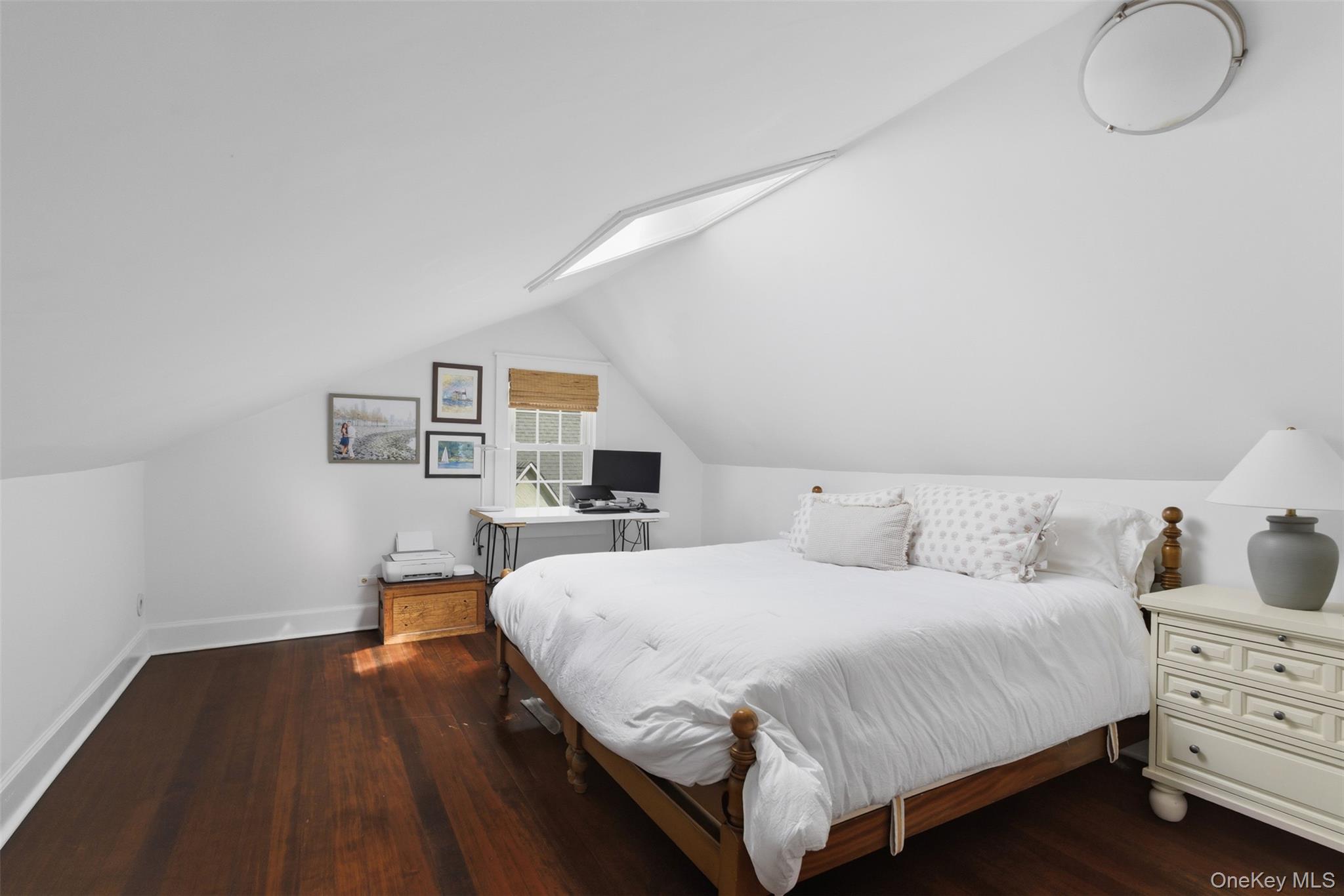 32 Kingsbury Road New Rochelle, NY 10804 - Photo 21 of 31 a bedroom with a bed and wooden floor