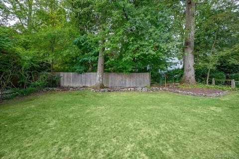 a view of a backyard with a small cabin