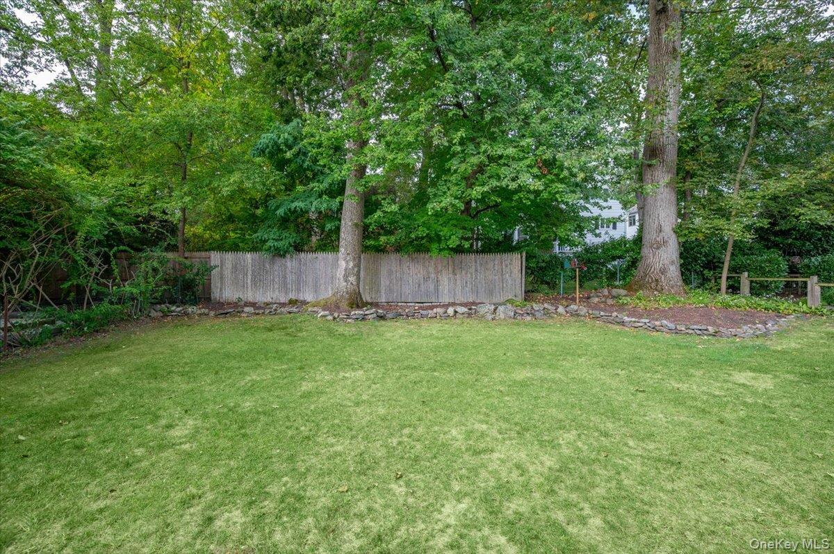 32 Kingsbury Road New Rochelle, NY 10804 - Photo 24 of 31 a view of a backyard with a small cabin