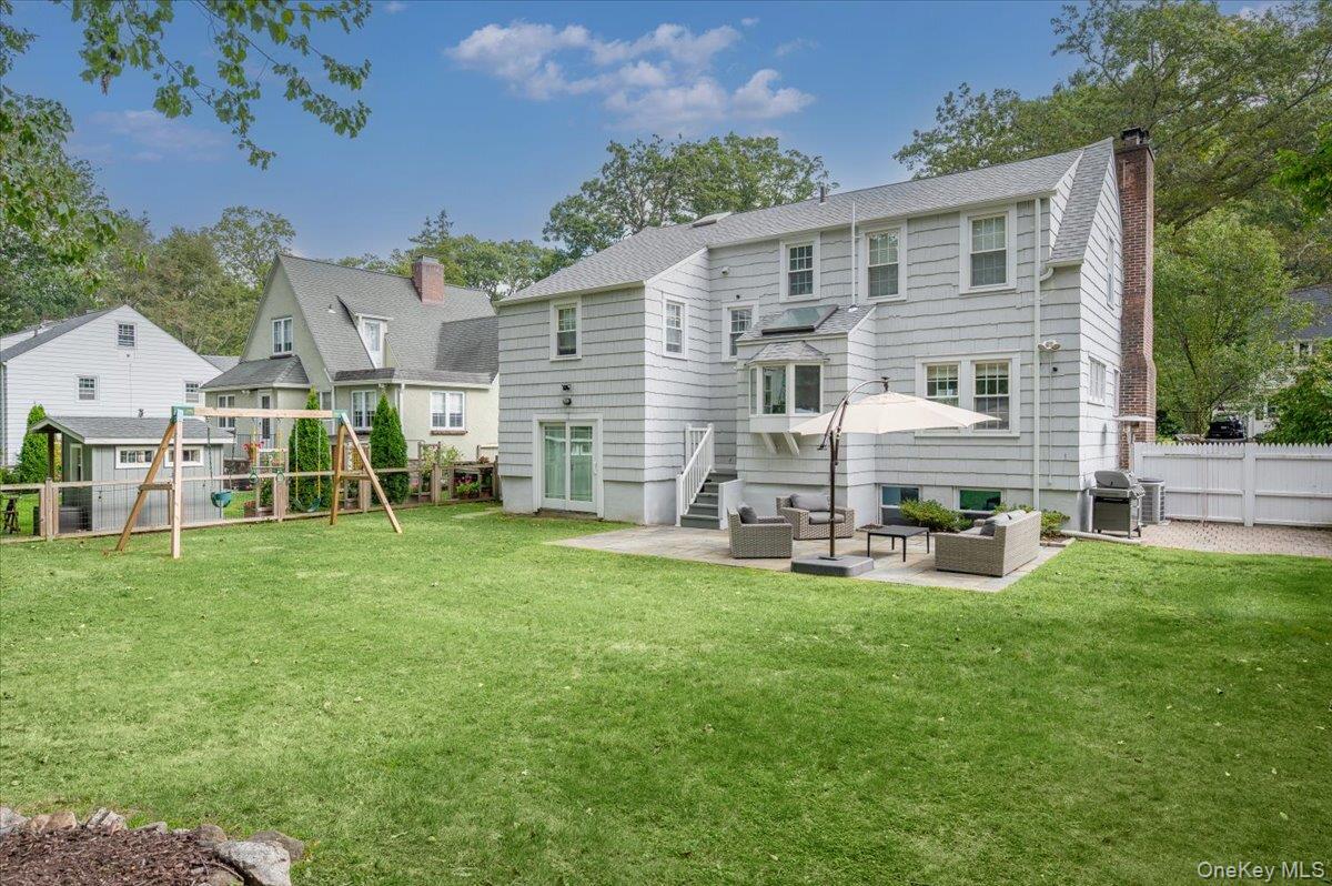 32 Kingsbury Road New Rochelle, NY 10804 - Photo 26 of 31 a view of a house with backyard porch and sitting area