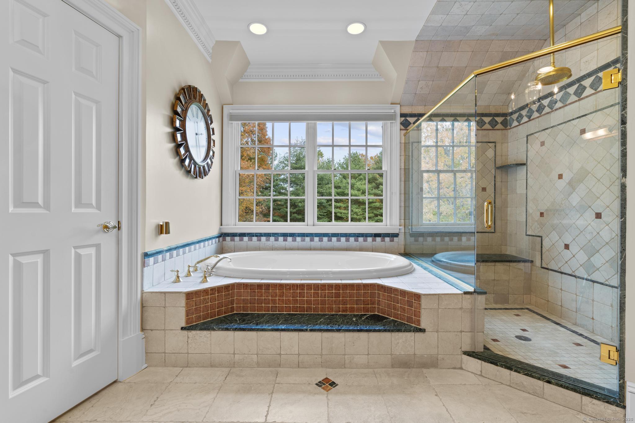 342 Midlock Road Fairfield, CT 06824 - Photo 20 of 40 Primary bath with pool views, jacuzzi tub, walk-in shower, double sink vanity, linen closet.
