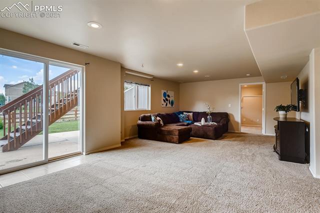 461 Talus Road Monument, CO 80132 - Photo 30 of 40 Large family room in basement!