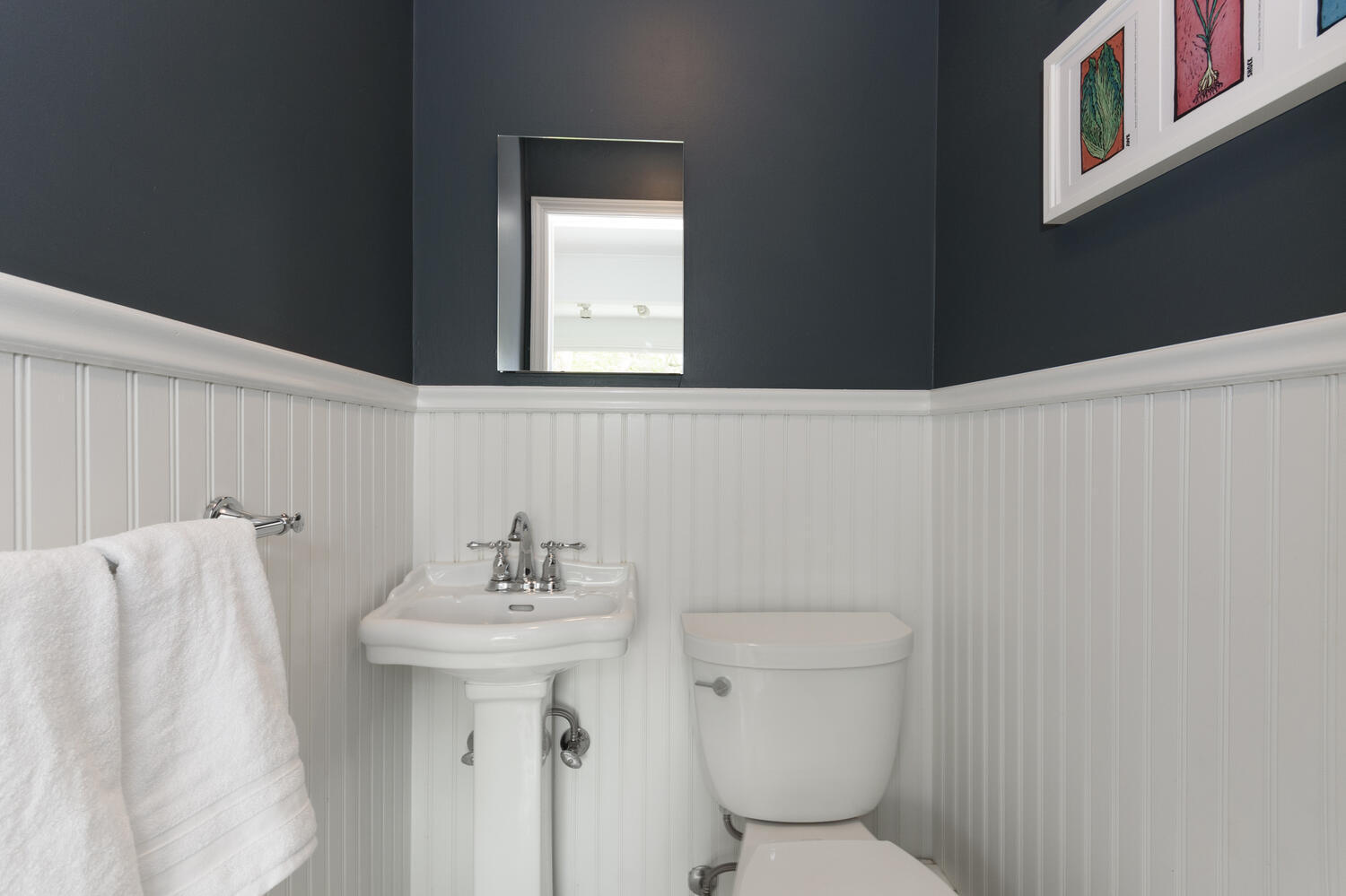 27 Hollow Tree Ridge Road Darien, CT 06820 - Photo 12 of 27 a bathroom with a sink a toilet and mirror
