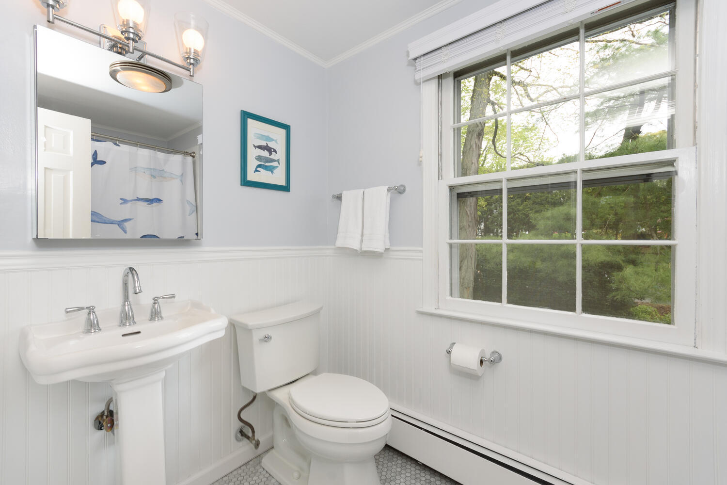 27 Hollow Tree Ridge Road Darien, CT 06820 - Photo 18 of 27 a bathroom with a sink a toilet and a window