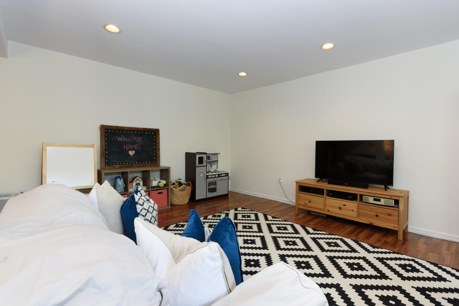 27 Hollow Tree Ridge Road Darien, CT 06820 - Photo 19 of 27 a living room with furniture and a flat screen tv