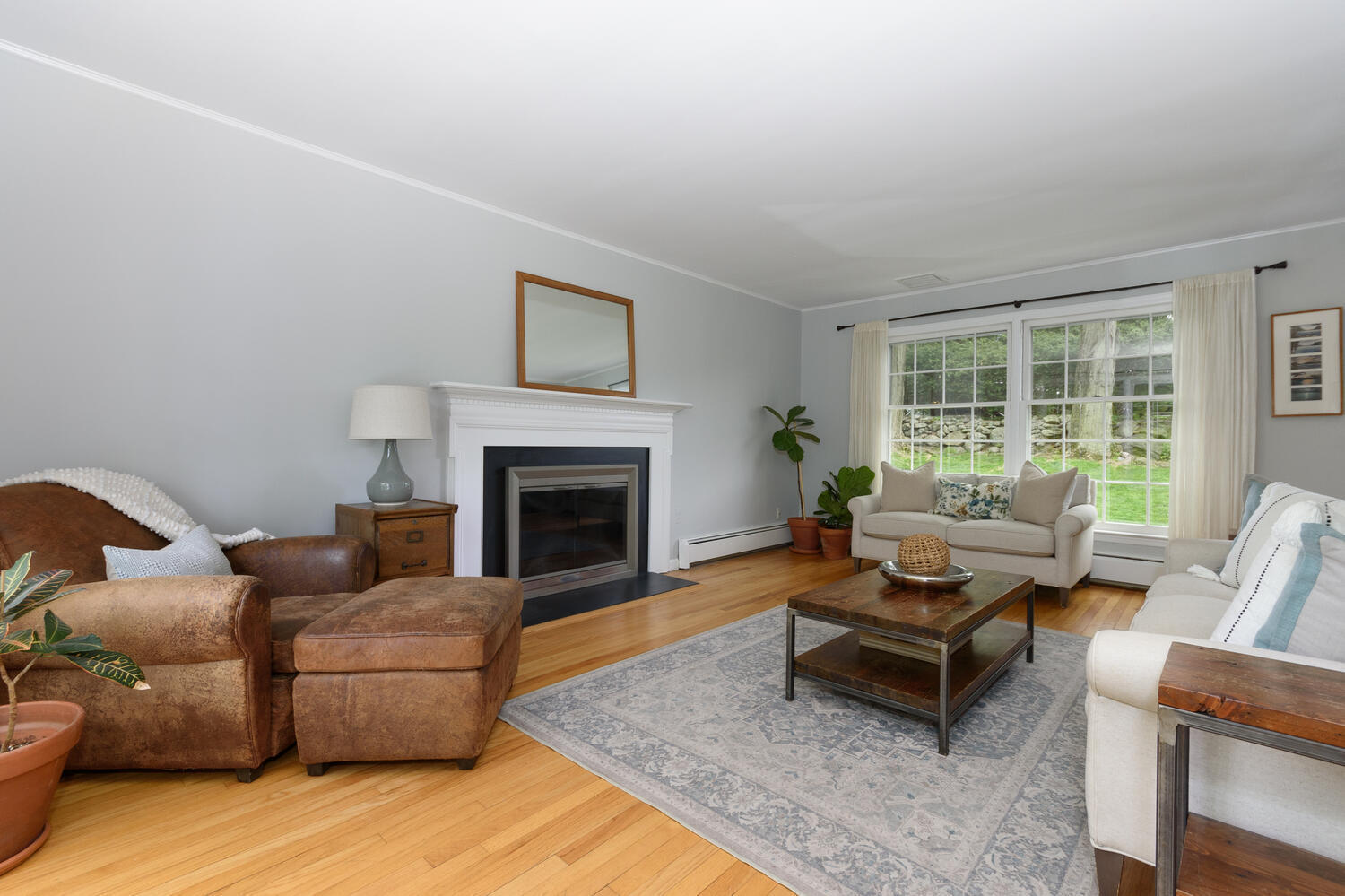 27 Hollow Tree Ridge Road Darien, CT 06820 - Photo 5 of 27 a living room with furniture and a fireplace