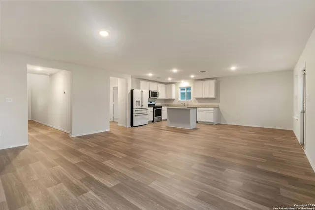 a view of kitchen with wooden floor