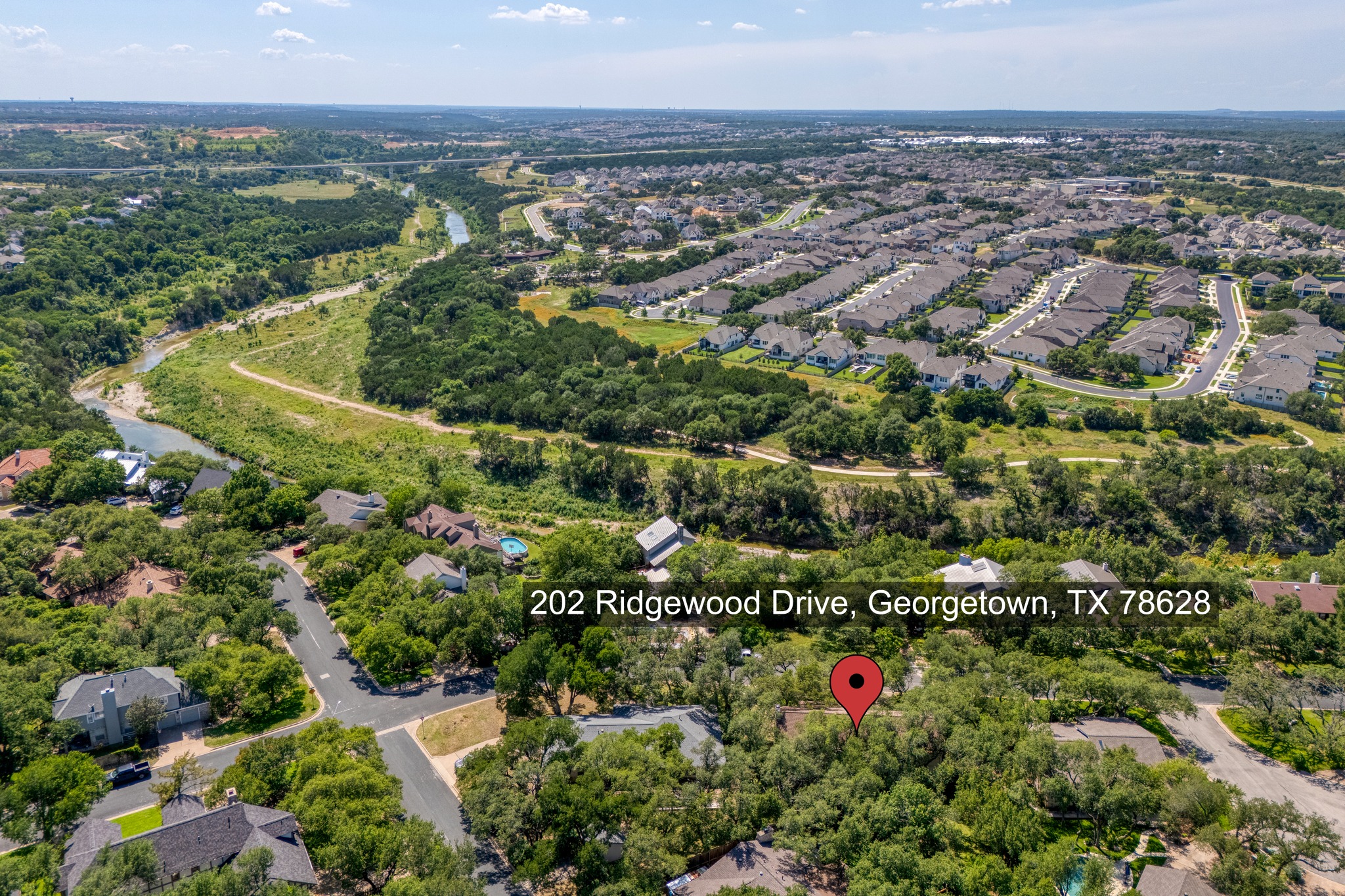 202 Ridgewood Drive Georgetown, TX 78628 - Photo 38 of 40 an aerial view of residential houses with outdoor space and trees