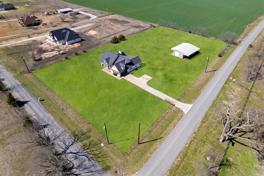 2885 Enloe Road Howe, TX 75459 - Photo 12 of 39 a view of a lake with a yard