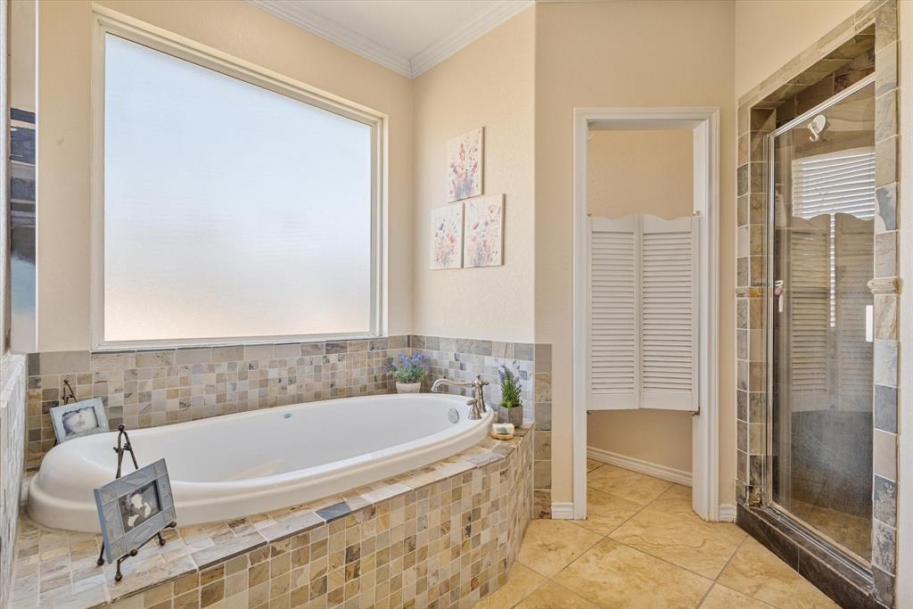 2885 Enloe Road Howe, TX 75459 - Photo 25 of 39 a bathroom with a tub and shower