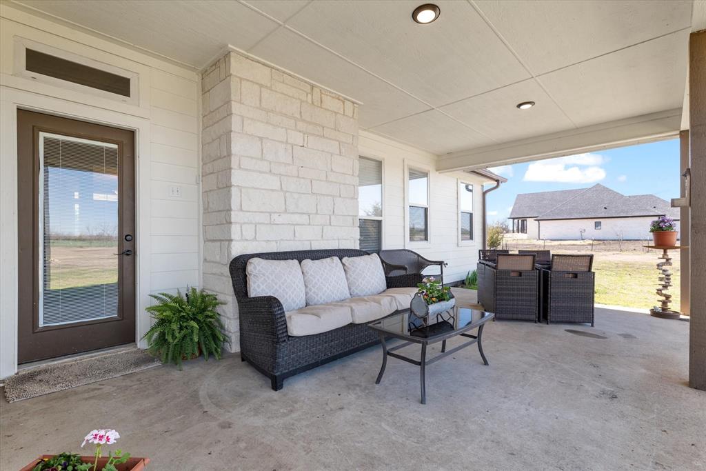 2885 Enloe Road Howe, TX 75459 - Photo 9 of 39 a living room with furniture and a potted plant
