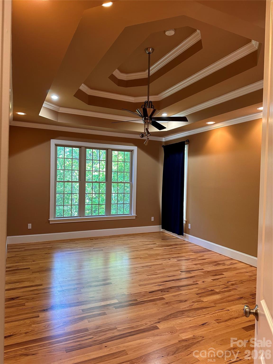 26 Stone House Road Arden, NC 28704 - Photo 16 of 21 a view of an empty room with wooden floor and a window