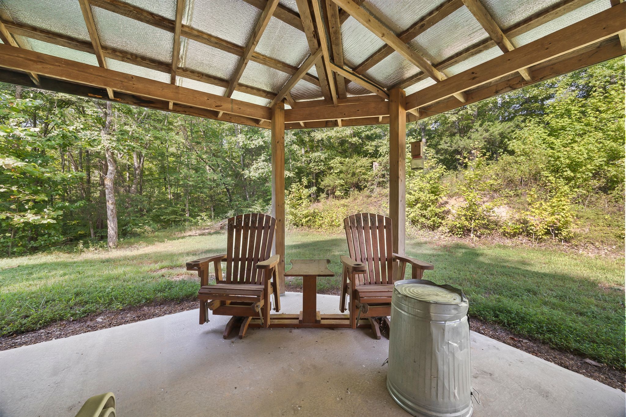 1582 Hellsneck Road Waverly, TN 37185 - Photo 18 of 72 a view of a chair and table in the garden
